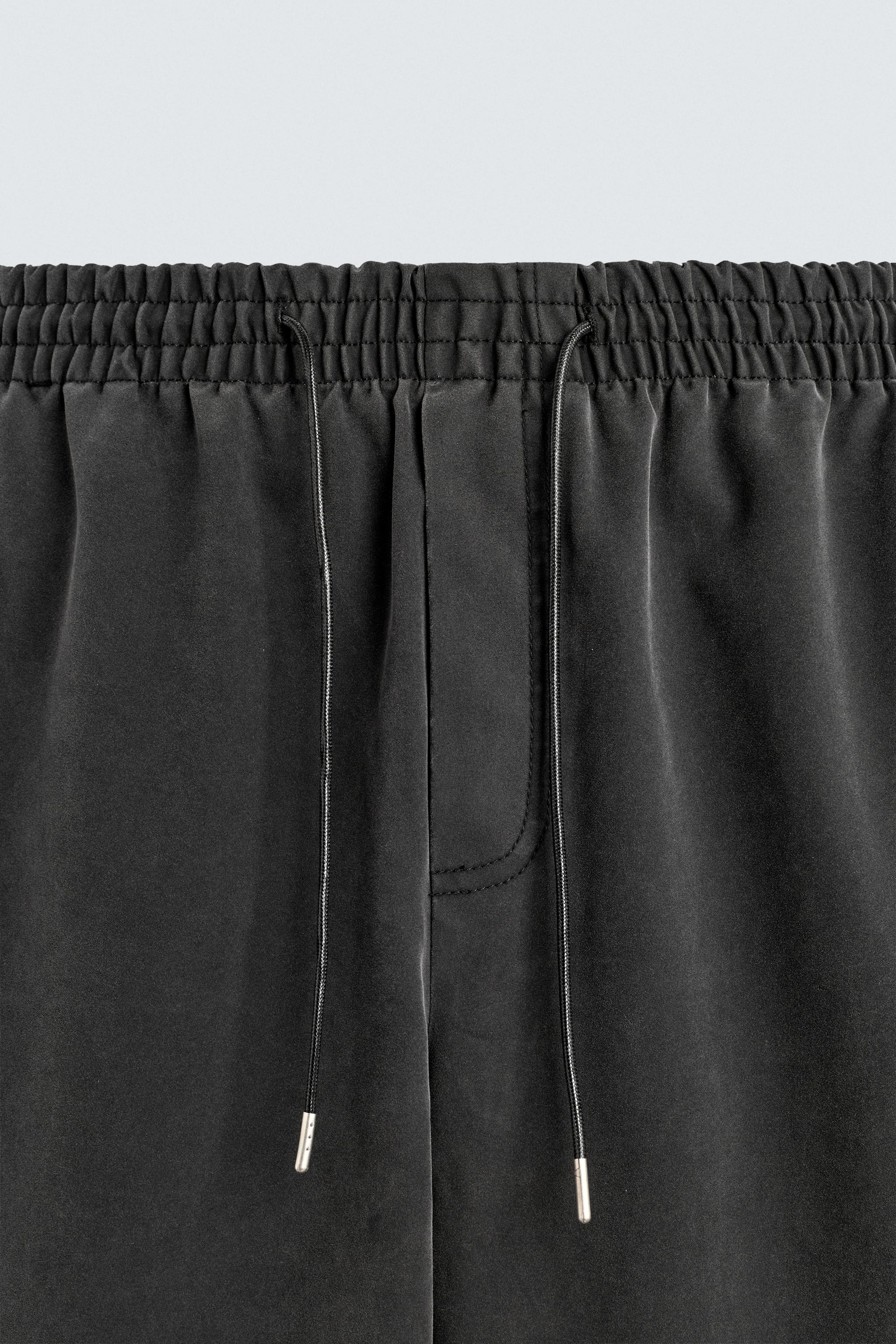 STUDDED FAUX LEATHER RELAXED FIT PANTS
